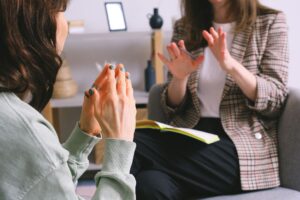 A resume coach reviewing a document with a job seeker across a table